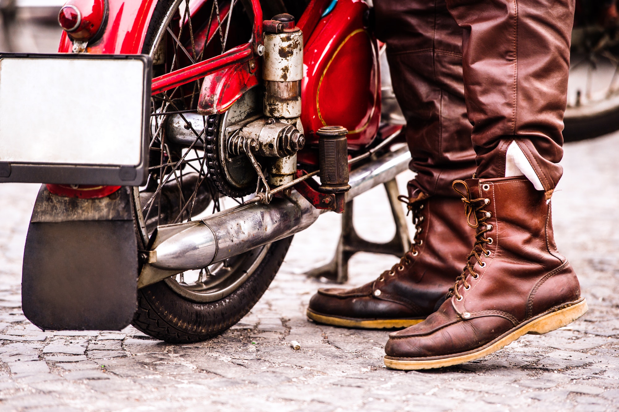 Unidentified biker with a vintage motorcycle at motorcycle festival